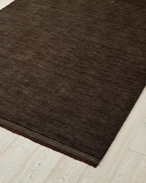 The Silvio wool rug by Weave Home in a ruich chocolate brown tone called Dovecote