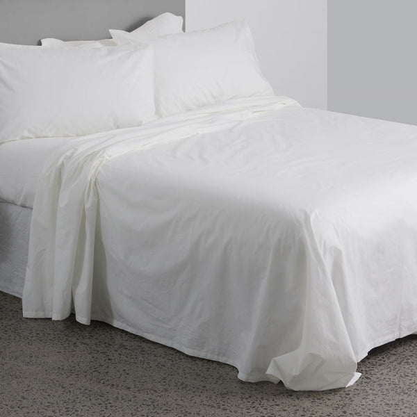 High quality 300 thread count 100% cotton white bed sheets seen on a bed