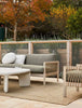 Braided outdoor rug by Globe West and Soren Liv, seen in a stylish outdoor setting with furniture
