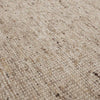 Close up of the weave of a textural woolen rug, in shades of cream, honey brown and light beige, with subtle colour shifts by Soren Liv NZ and Globe West. 