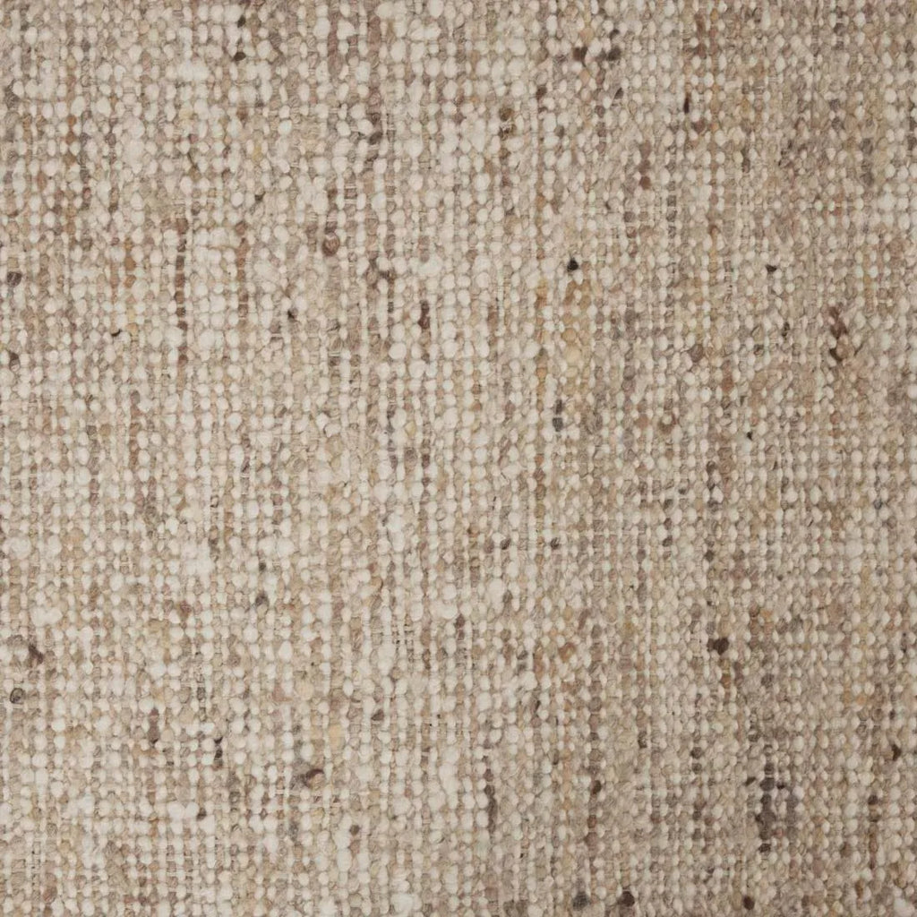 Close up of the weave of a textural woolen rug, in shades of cream, honey brown and light beige, with subtle colour shifts by Soren Liv NZ and Globe West. 