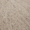 Close up of the weave of a textural woolen rug, in shades of cream, honey brown and light beige, with subtle colour shifts by Soren Liv NZ and Globe West. 