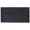 Full view from above of a dark blue wool blend floor rug by Globe West and Soren Liv