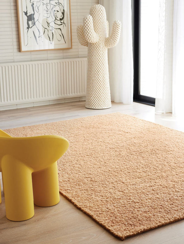 The Tribe Home Roam wool rug in colour 'Sunrise' seen here in a contemporary living room