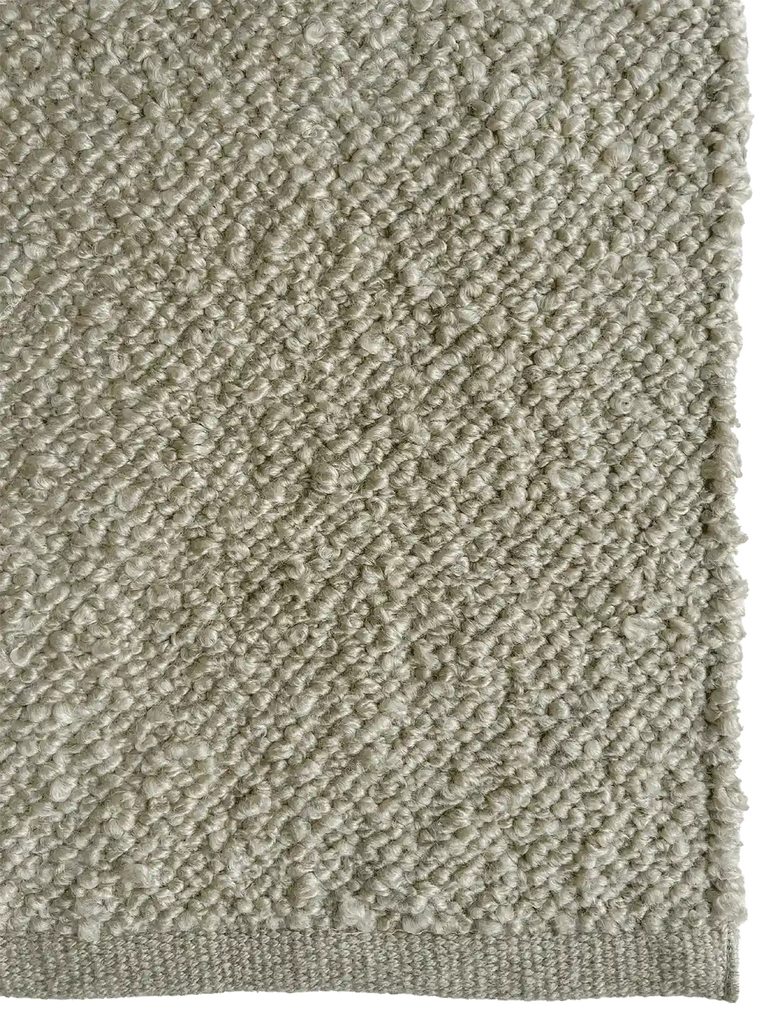 Close up of the Tribe Home Finn outdoor rug in pale green