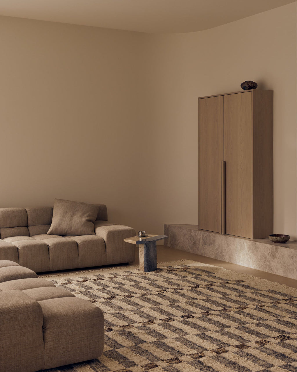 Tribe Home Chet wool and jute rug in a living room with a low modular sofa