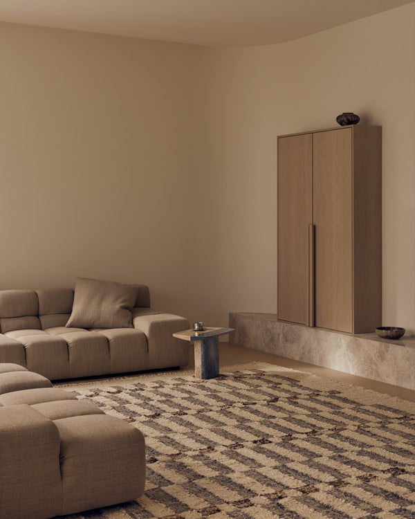 Tribe Home Chet wool and jute rug in a living room with a low modular sofa