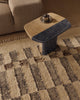 Close view of the Tribe Home Chet wool and jute rug beneath a coffee table