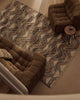 Tribe Home Orissa wool and jute rug in a living room with brown armchairs