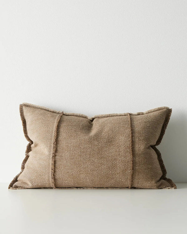 Brown lumbar cushion with textured edges on a white background