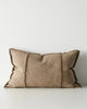 Brown lumbar cushion with textured edges on a white background