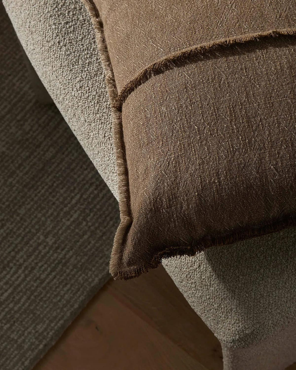 Close-up of a textured brown cushion.