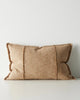 Warm beige cushion with textured edges on a light gray background