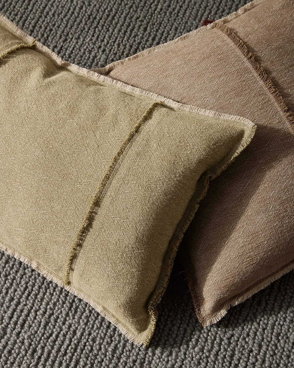 Close-up of textured brown cushions on a gray surface