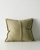 Green cushion with textured edges on a white background