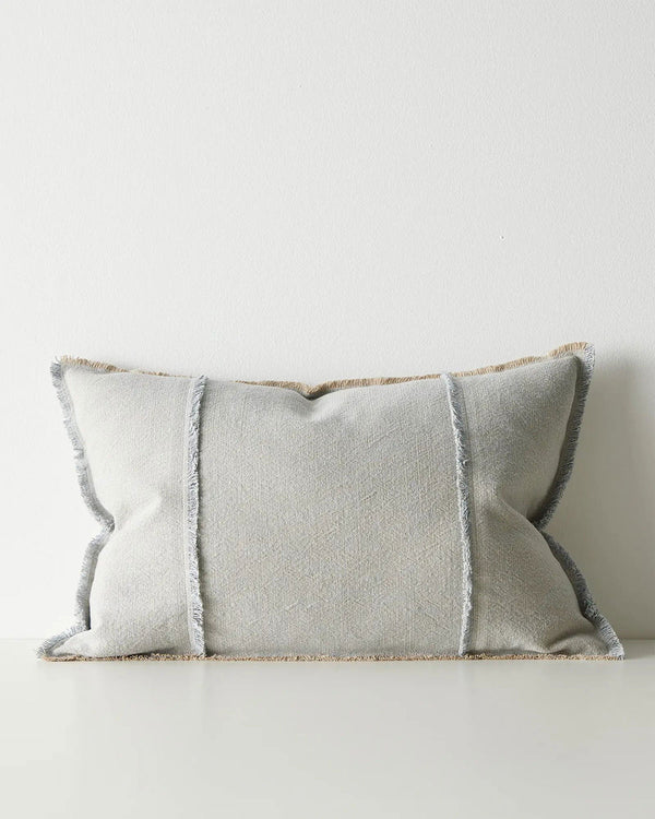 Gray lumbar cushion with textured edges on a white background