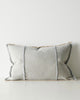 Gray lumbar cushion with textured edges on a white background
