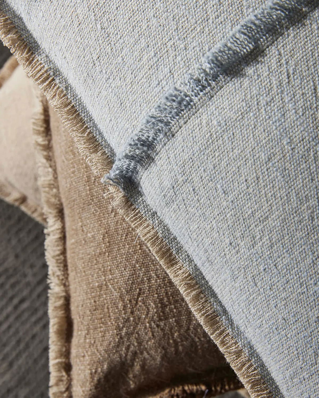 Close-up of a textured cushion with a neutral color palette.