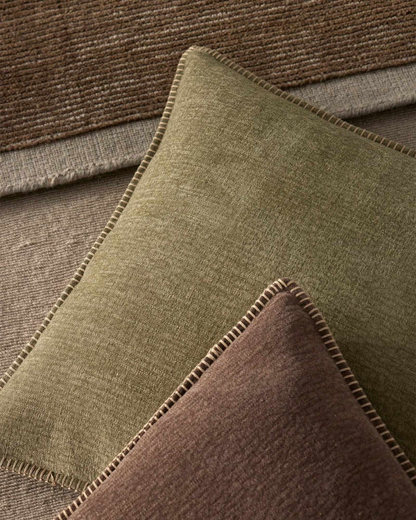 Designer cushions in green and brown with an elegant stitching feature, by Weave Home