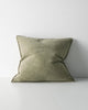 Green cushion with a stitch detail, on a white background