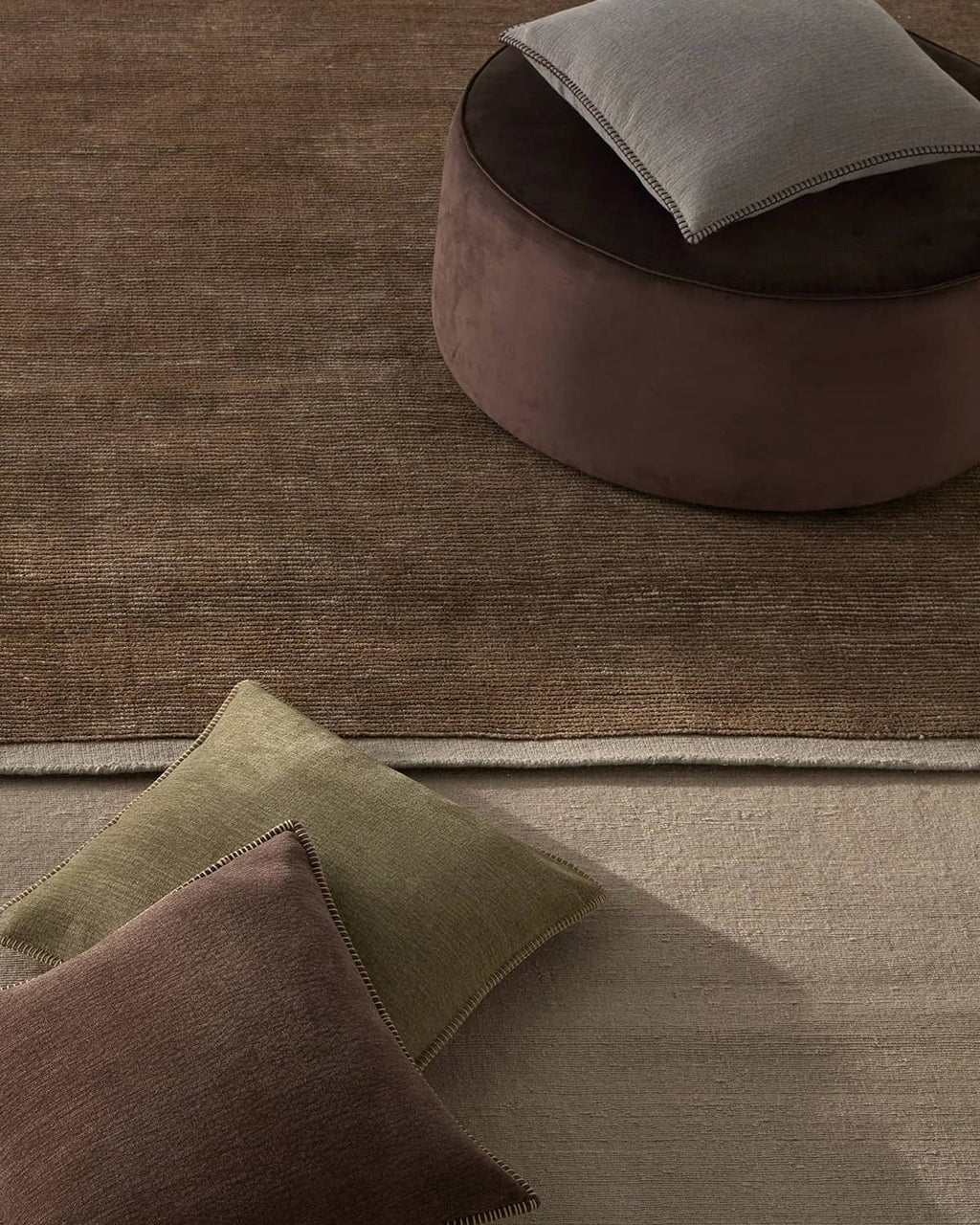 Two differnt woool rugs with designer cushions