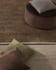 Two differnt woool rugs with designer cushions