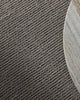Close-up of a textured gray carpet corner