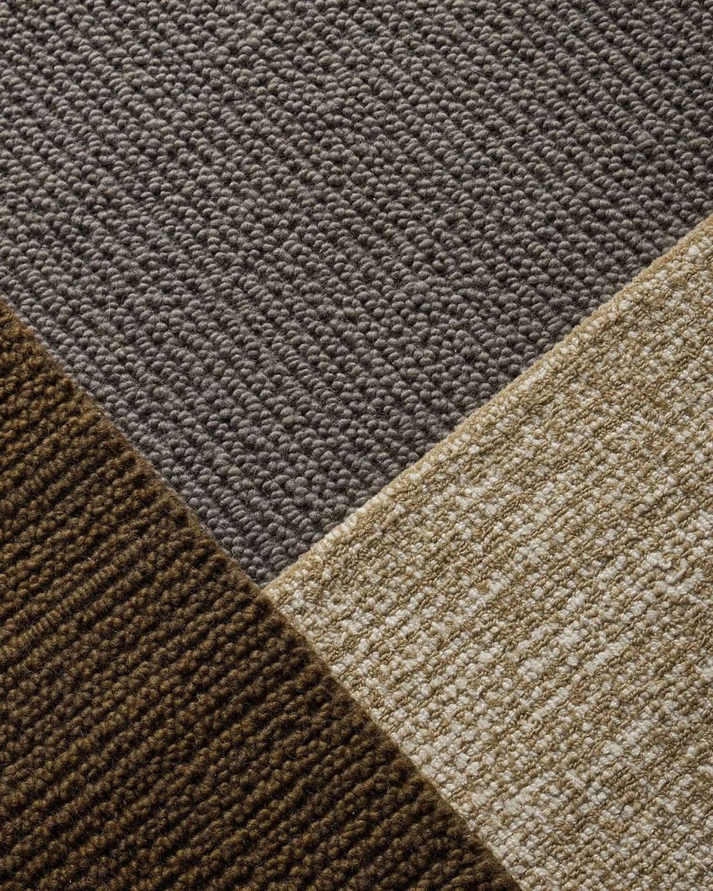 Close-up of a textured rug with brown, gray, and beige colors.