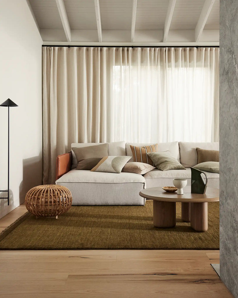 A contemporary NZ living room setting featuring Weave Home cushions in a range of neutrals