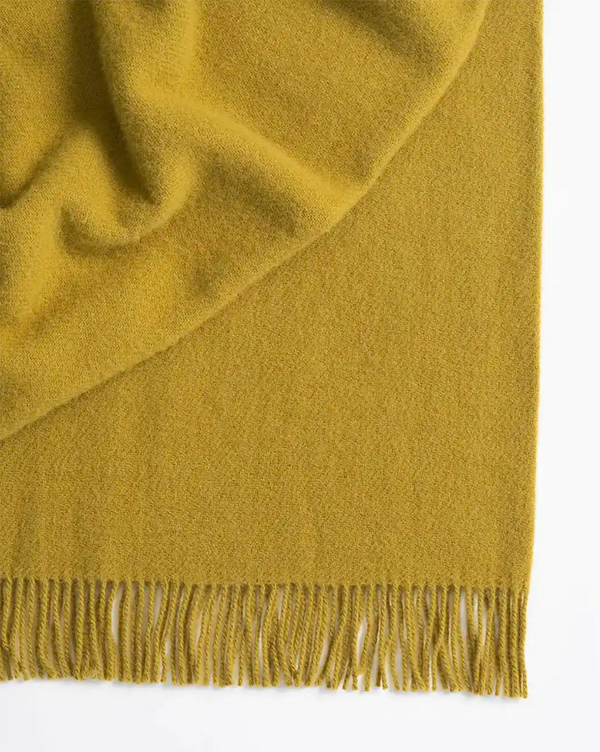 Weave Home wool throw blanket in colour 'chartreuse' - a vibrant yellow-green