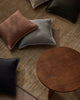 Weave Home Beige rug with table and cushions in a stylish lounge