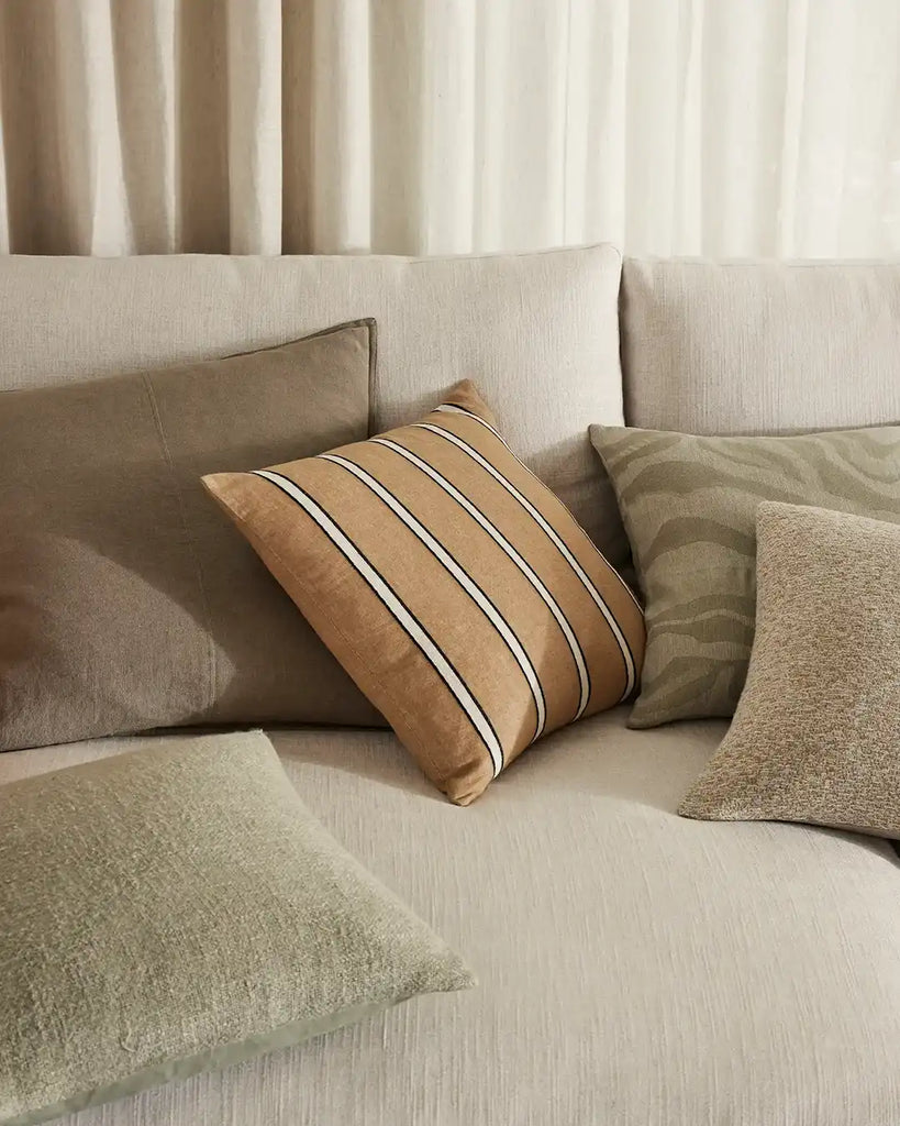 A stylish combination of Weave Home cushion designs on a neutral couch