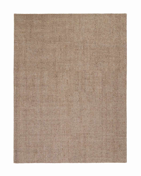 A full image of a warm taupe floor rug with a textural loop pile and a very subtle variation in tone in the weave. 