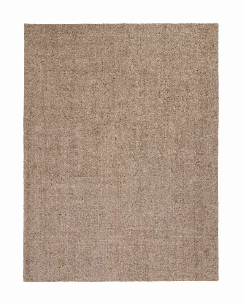 A full image of a warm taupe floor rug with a textural loop pile and a very subtle variation in tone in the weave. 