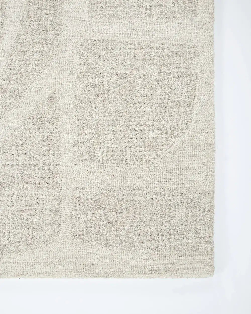 Close up of the corner of the Baya patterned wool floor rug 'Maya' 