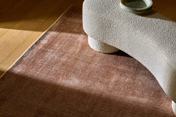 Dusty pink wool blend floor rug in a contemporary home