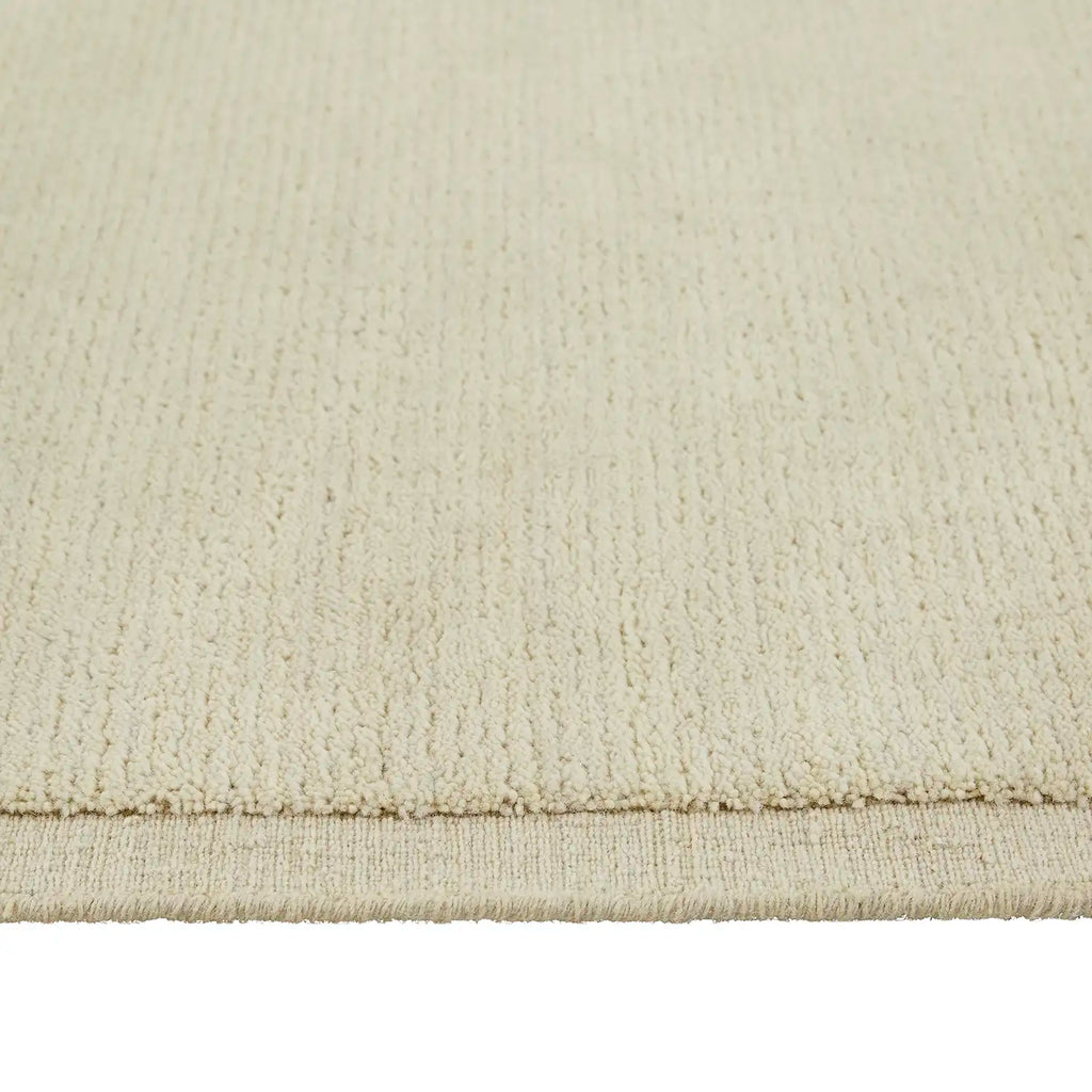 Close up of the contrast woven frame detail in the 100% wool Bower Frame floor rug