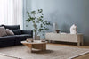 A textural woolen rug, in shades of honey brown and light beige, with subtle colour shifts by Soren Liv NZ and Globe West, in a stylish modern living room 