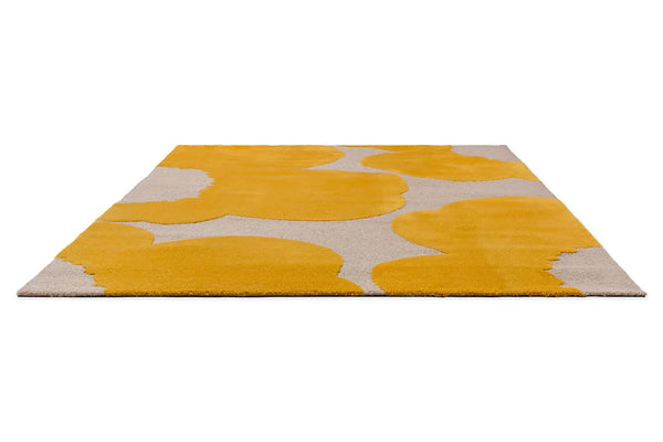 Perspective view of the Marimekko Iso Unikko wool rug in yellow