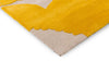Close up corner view of the Marimekko Iso Unikko wool rug in yellow
