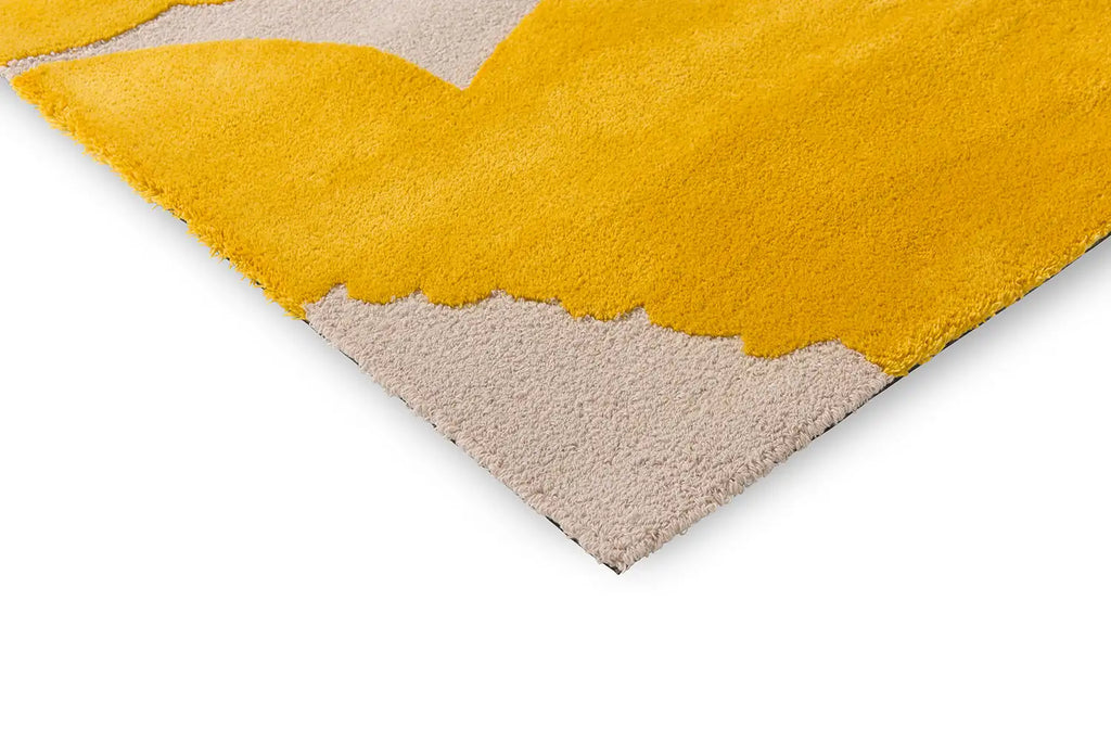 Close up corner view of the Marimekko Iso Unikko wool rug in yellow