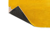 Corner close up of the Marimekko Iso Unikko wool rug in yellow with corner folded to reveal underneath