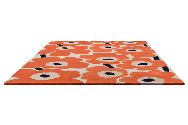 Full perspective view of the Marimekko Unikko wool floor rug in orange-red