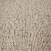 Close up of the weave of a textural woolen rug, in shades of cream, honey brown and light beige, with subtle colour shifts by Soren Liv NZ and Globe West. 