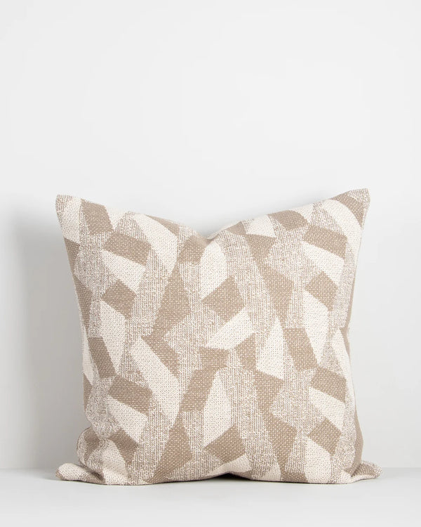 A woven abstract patterned cushion in soft beige and ivory colours, by Baya nz