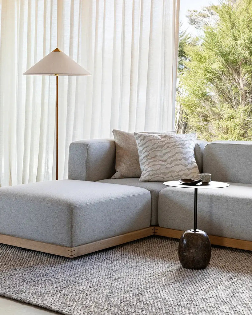 Baya white and beige patterned cushion on a couch in a contemporary home