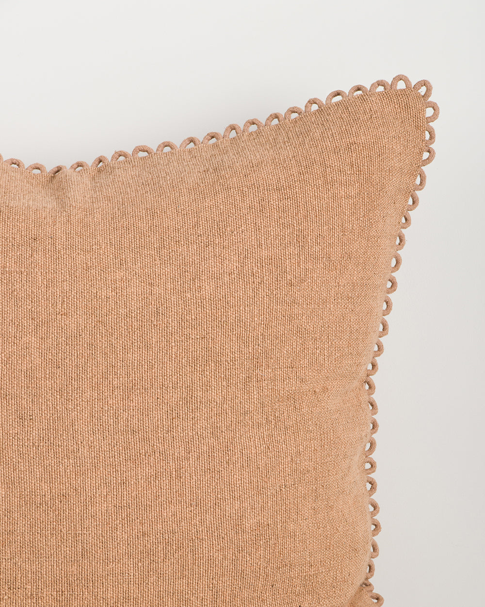 Baya Alden linen cotton blend cushion in Clay, close view of the loop-edge trim