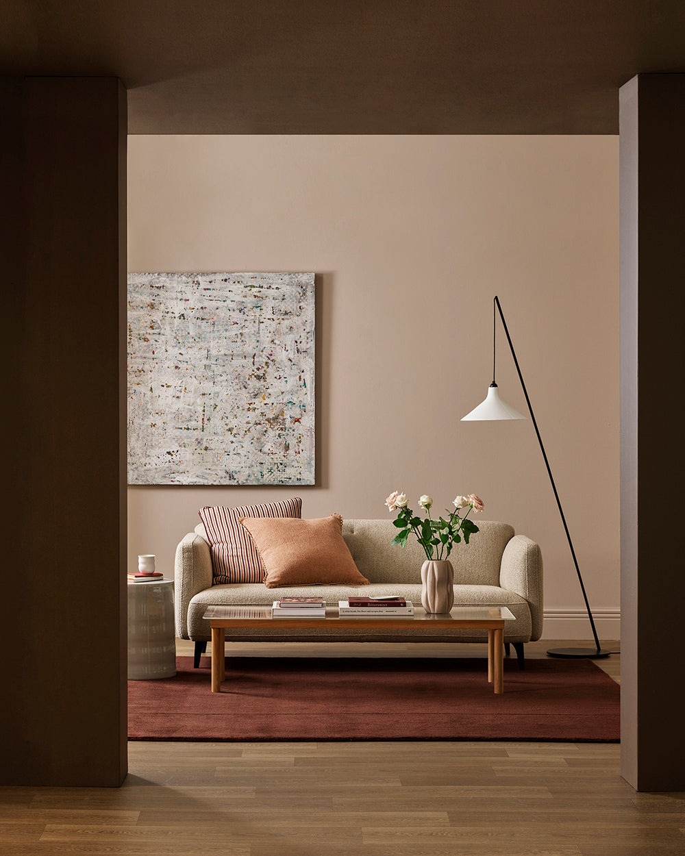 Baya Alden linen cotton blend cushion in Clay, styled on a sofa in a living room