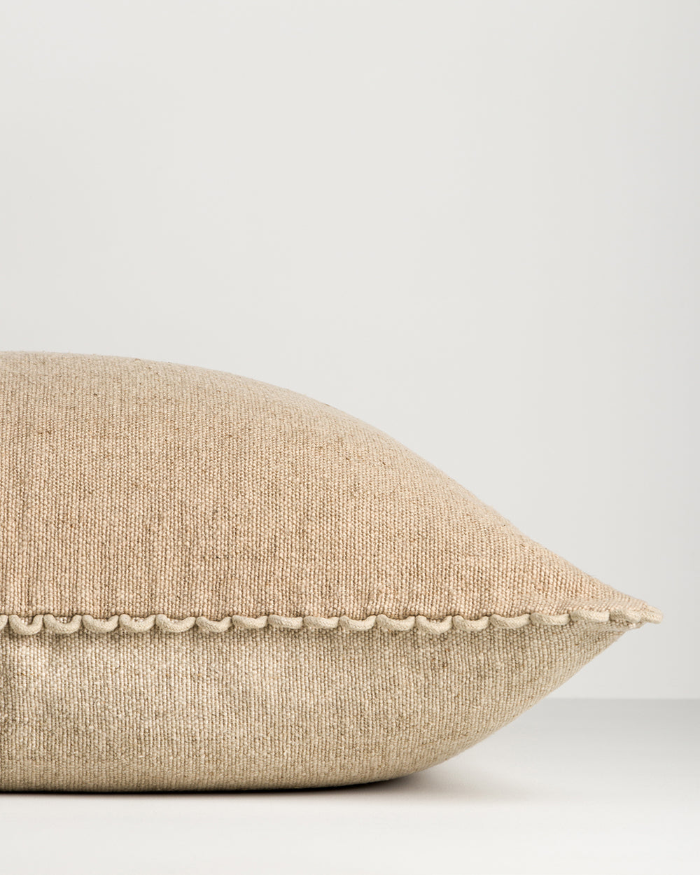 Baya Alden linen cotton blend cushion in Oat, side view showing the two reversible shades