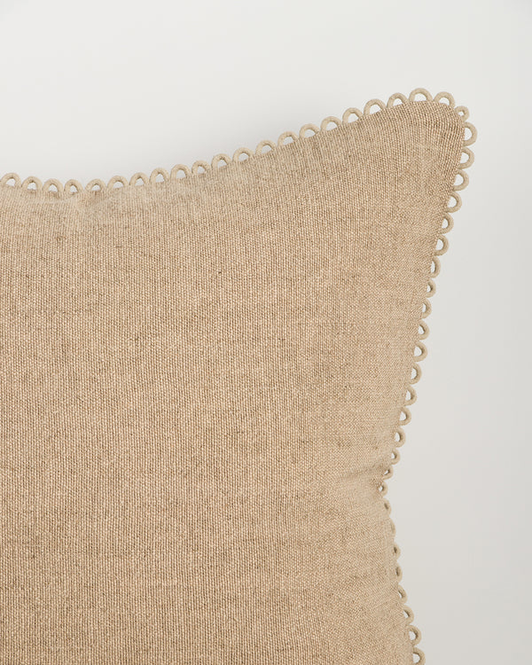 Baya Alden linen cotton blend cushion in Oat, close view of the loop-edge trim